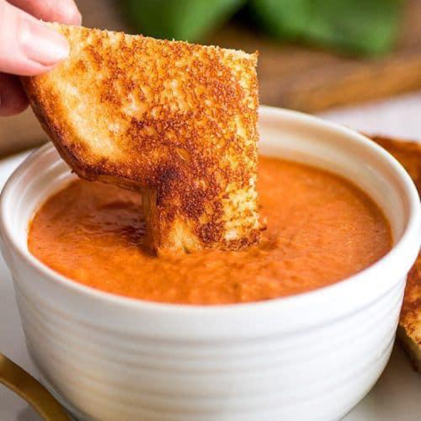 Grilled cheese dipped in tomato soup