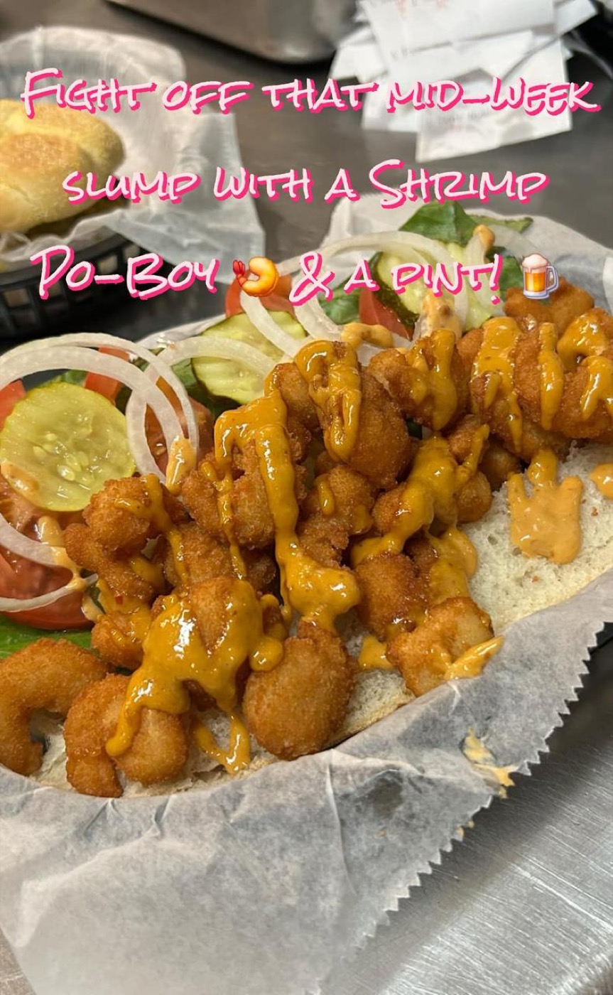 Shrimp po-boy sandwich with sauce drizzle