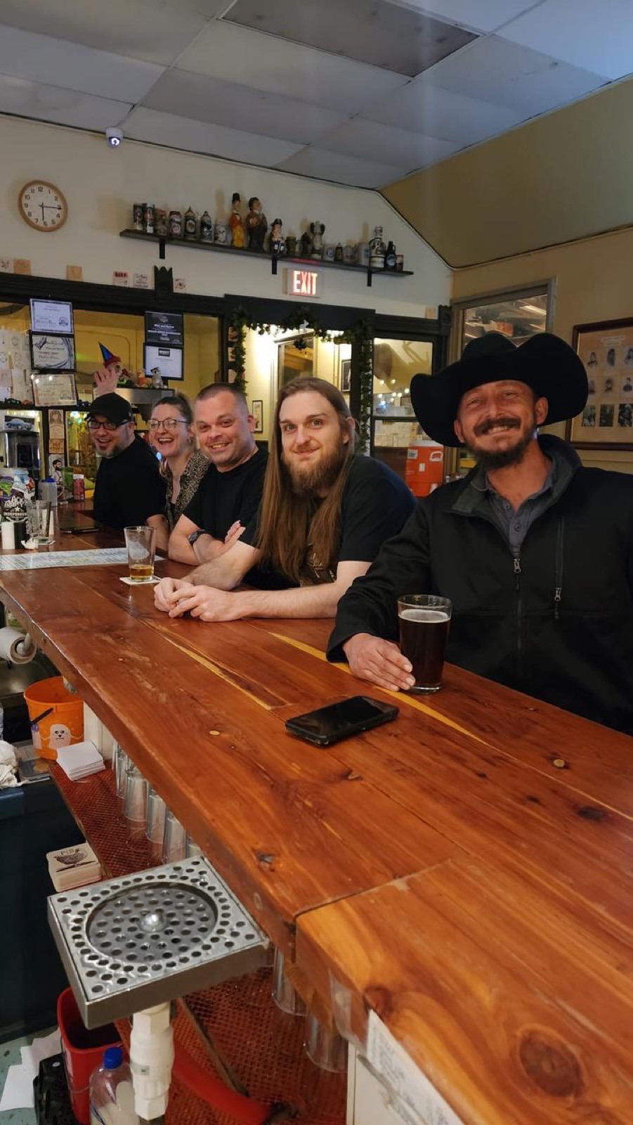 Friends gathered at the Pint & Barrel bar